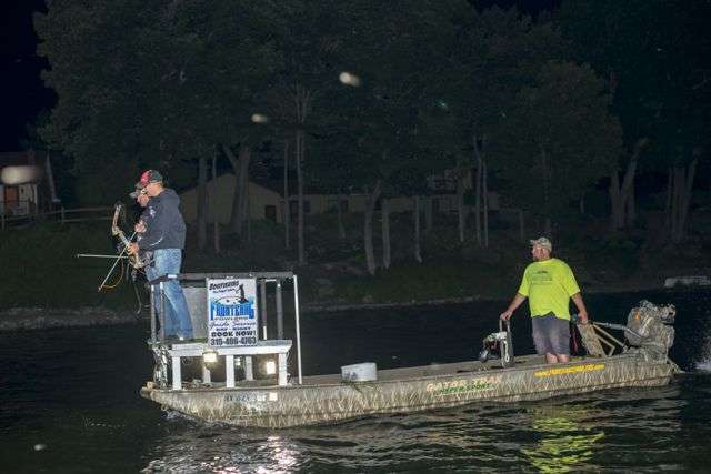 Mullins and Roy, perched on the shooting deck of the Gator Trax boat, are both accomplished bowhunters. Mullins' boat wrap sponsor is New Breed Archery.  But neither Mullins nor Roy had ever been bowfishing. 