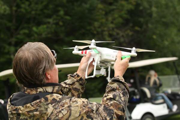 Bassmaster cameraman Carey Barrett flies a drone to catch the action.