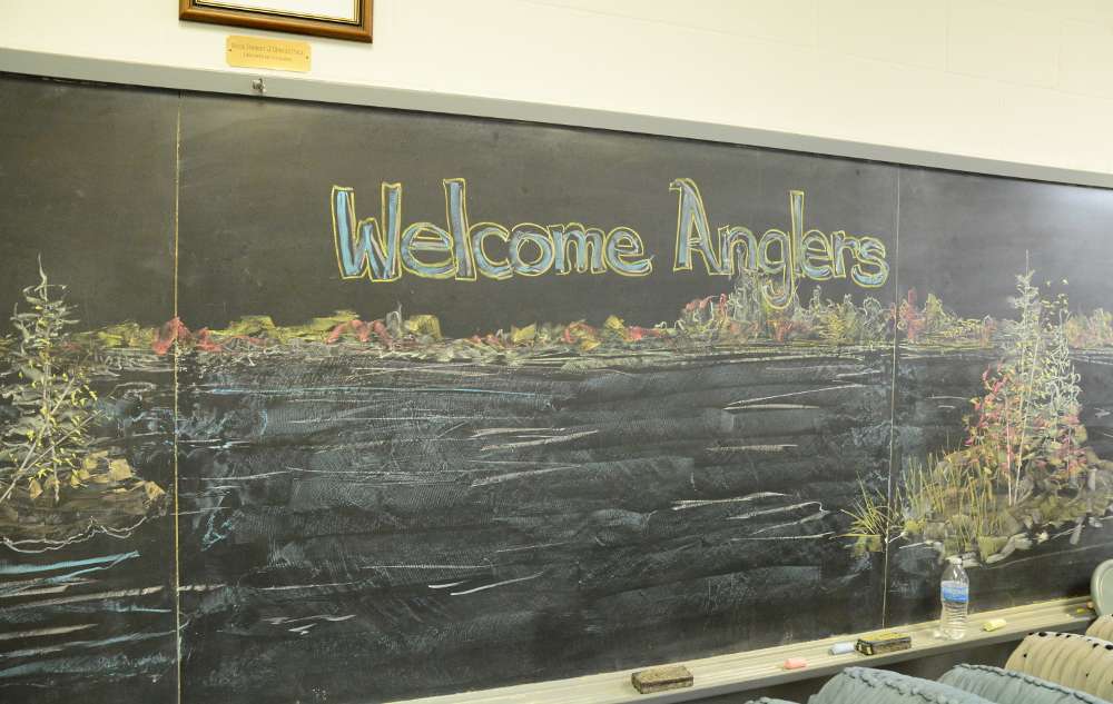 Church volunteers welcomed the anglers with a chalkboard drawing ...