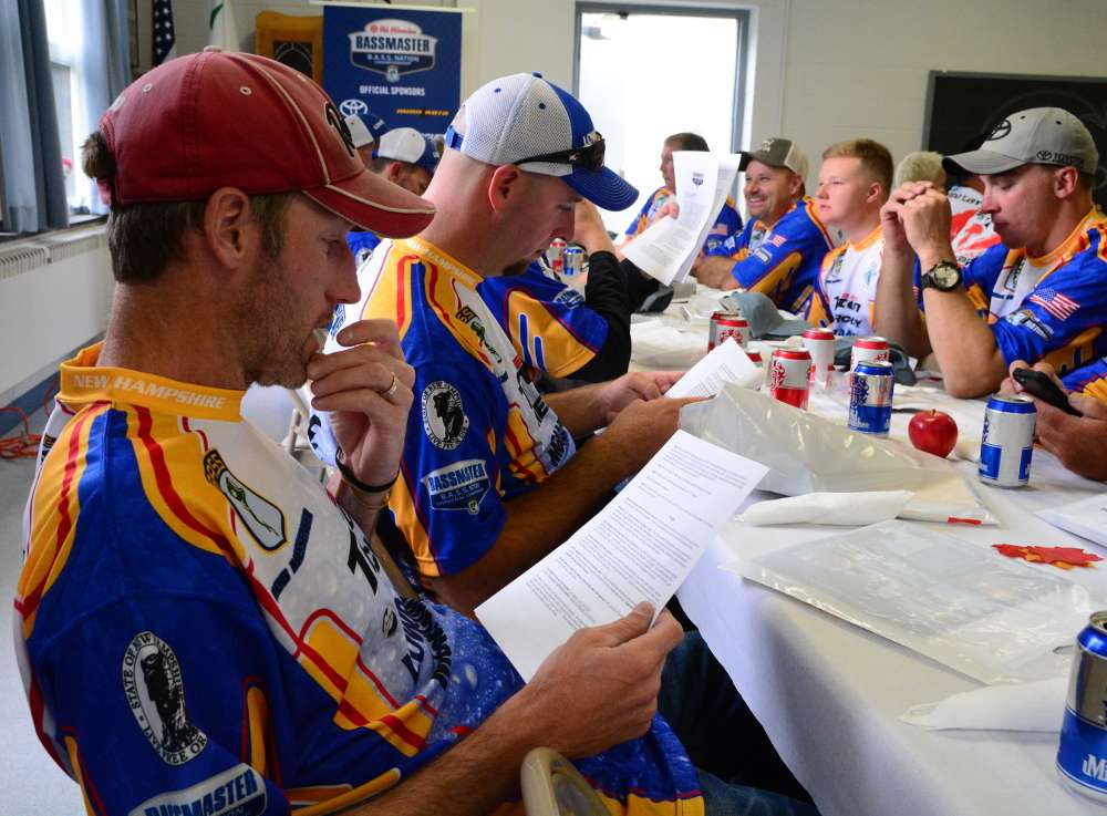 Some anglers spend their time looking carefully over the rules of the tournament.