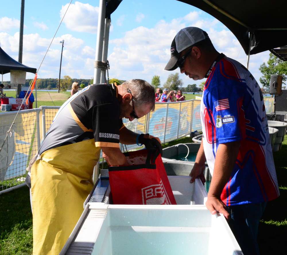 Competitors get their fish checked as they come in off the water.