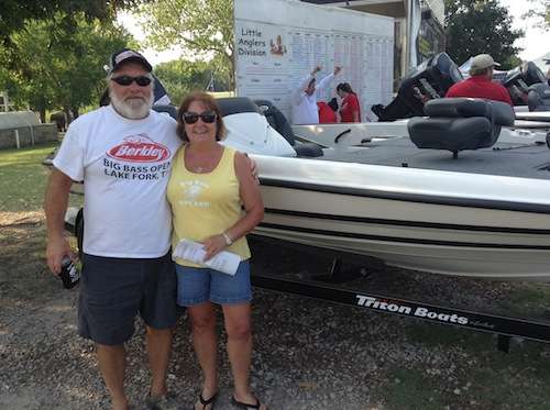 Kathy Morrison and husband with her new Triton 18XS Bass Boat.
