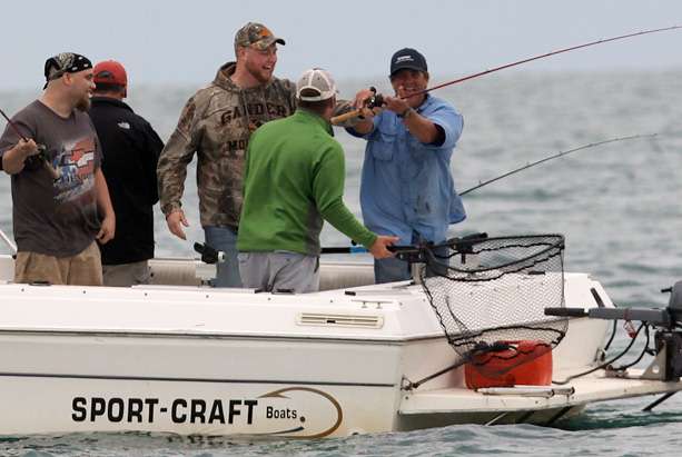 Nearby a group on a charter trip was having a large time fishing Lake St. Clair.
