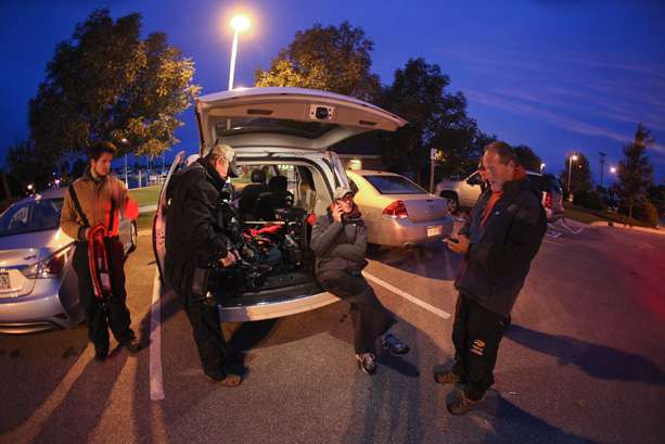 The Bassmaster television crew gets the word and starts packing their gear. 
