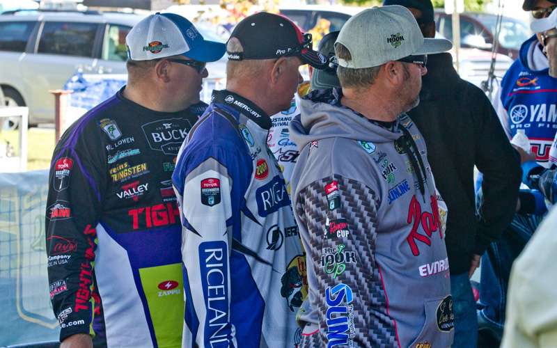 Bill Lowen, Scott Rook and Brett Hite check out the anglers who are coming to the line.
