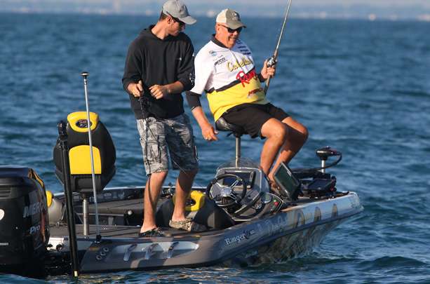 Co-angler Chris Liobos, fishing with pro Dave Smith, hooks up in the back of the boat. 