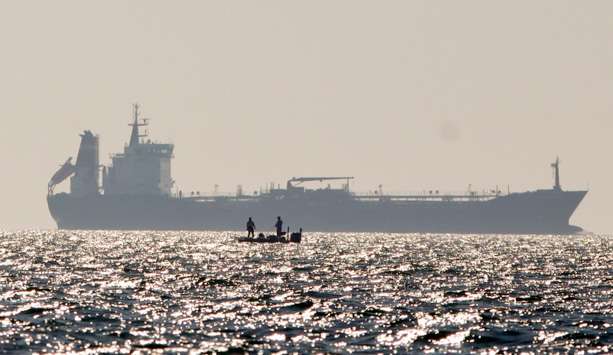 Competitors share Lake St. Clair with vessels much larger than their own. 