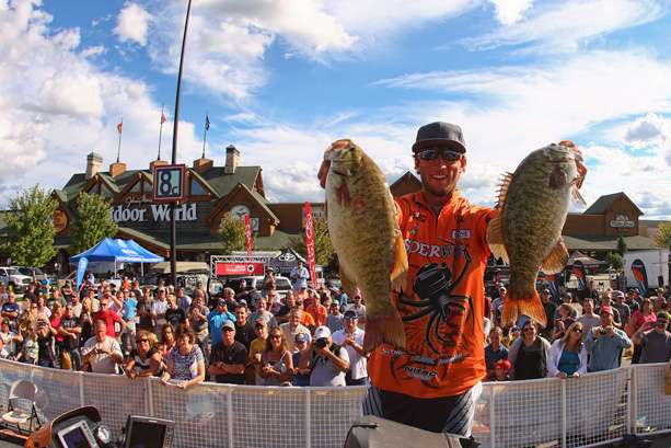 Fletcher Shryock pulls two of his largest fish from the live well to show to the crowd. 