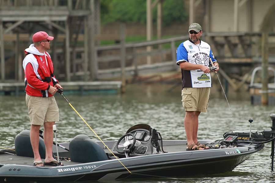 After his recent fish catches, he talks over his new gameplan with his co-angler.