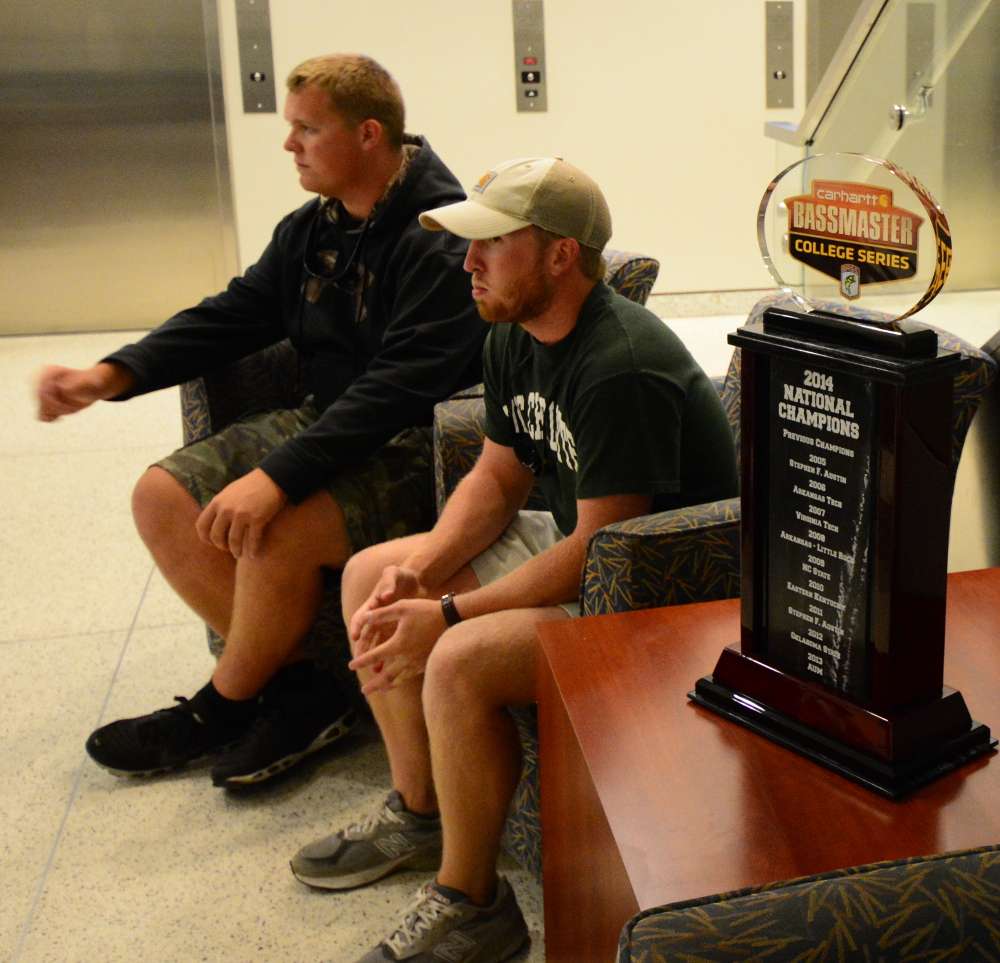 Jake Whitaker and Andrew Helms brought their trophy to the University of North Carolina at Charlotte campus for a meeting of their bass club. They wait in the lobby here to prepare for their B.A.S.S. Twitter chat.