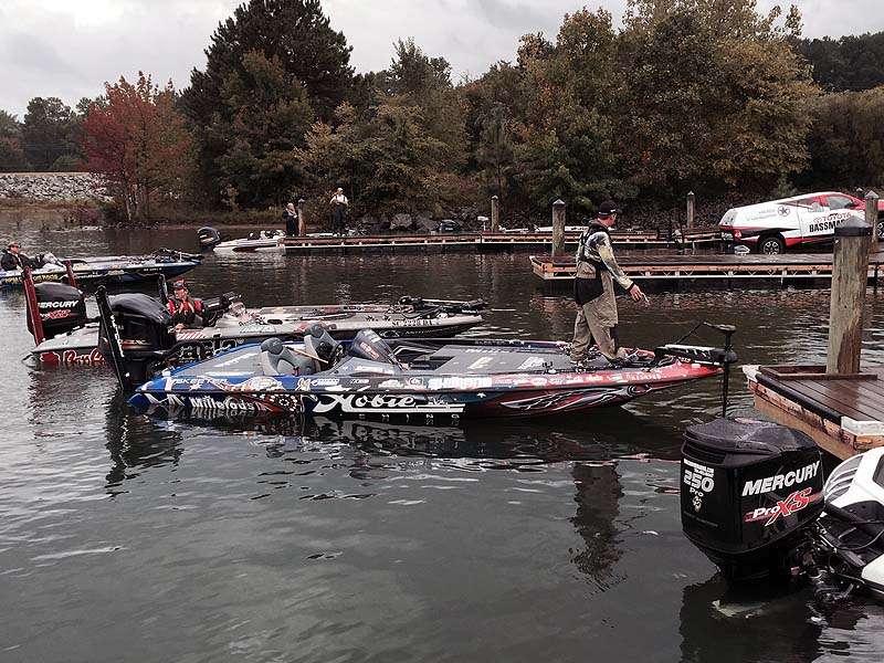 The boats linger around the boat ramp following weigh-in for loading out. 