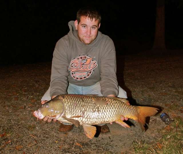 Josh Cook displays another one of the double-digit carp caught at Pop's Lake. Nineteen of the 29 carp caught by our group weighed between 15 and 20 pounds.