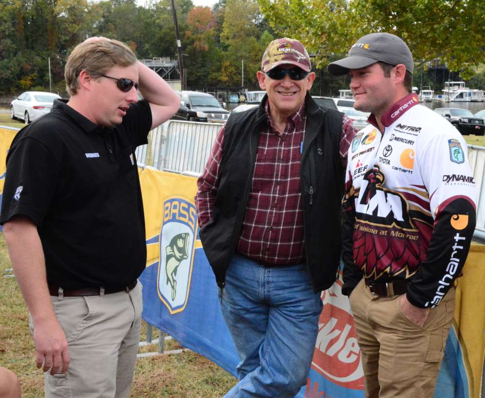 The 2014 Carhartt Bassmaster College Series qualifier for the Bassmaster Classic, Brett Preuett, was presented with his newly wrapped boat and truck at the 2014 Old Milwaukee B.A.S.S. Nation Championship. Here, Preuett and University of Louisiana Monroe (ULM) president Dr. Nick Bruno meet with College B.A.S.S. manager Hank Weldon.