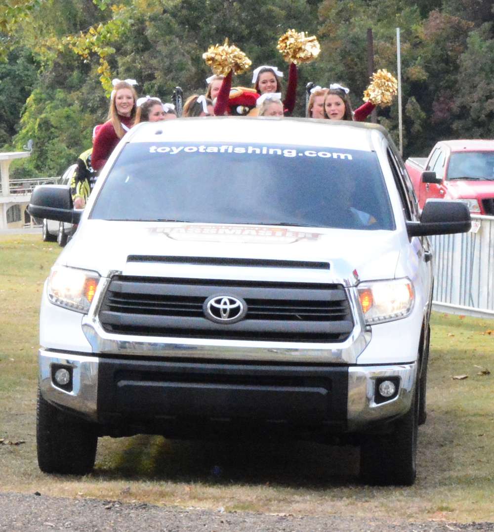 About a dozen of the ULM cheerleaders are in tow.