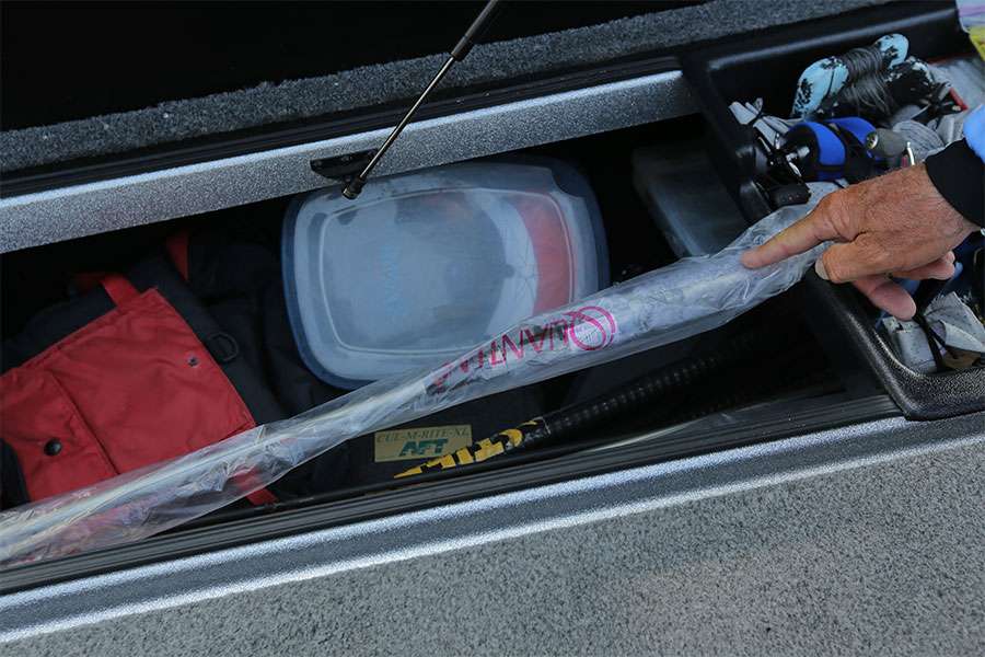 This is the starboard side rod box. In it are hats, PFDs, a spare trolling motor and extra brand new rods. He keeps the rods in there because they don't fit in the bed of his truck.