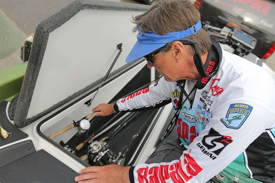 Starting with the main rod locker, Schultz reaches for a Shimano baitcasting outfit.