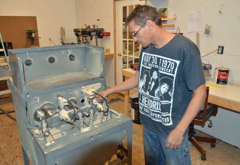 Caleb Jones, who represents one-third of Hunt's workforce, mans the duplicator. There are less than ten of these machines in the country. It takes two sticks of balsa at a time to make two plugs at a time.