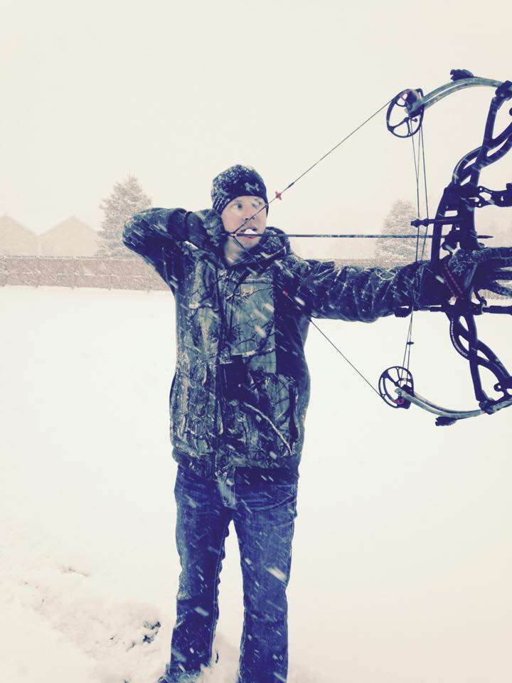 Jonathon VanDam practices bow shooting during an early November snow in Michigan.