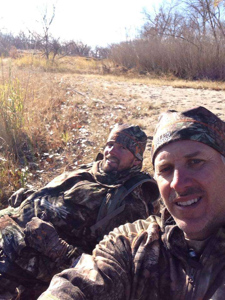 Elite angler David Mullins kicks back on a creek bank in Nebraska while filming for Moultrieâs <i>Hit List</i> with Andy Morgan, a co-host on the show with Swindle. 