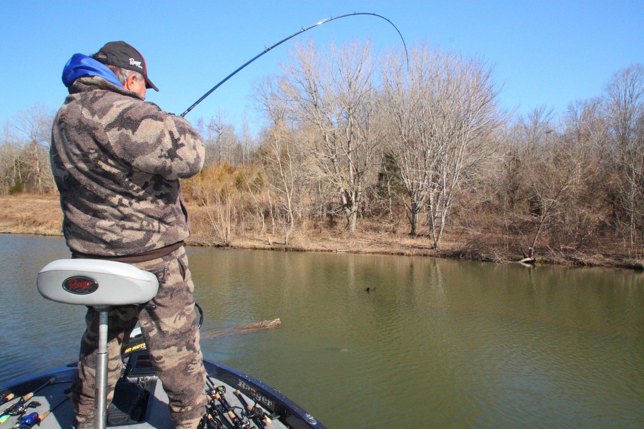 9:46 a.m. Brauer hooks a good fish on a submerged log with a jig.