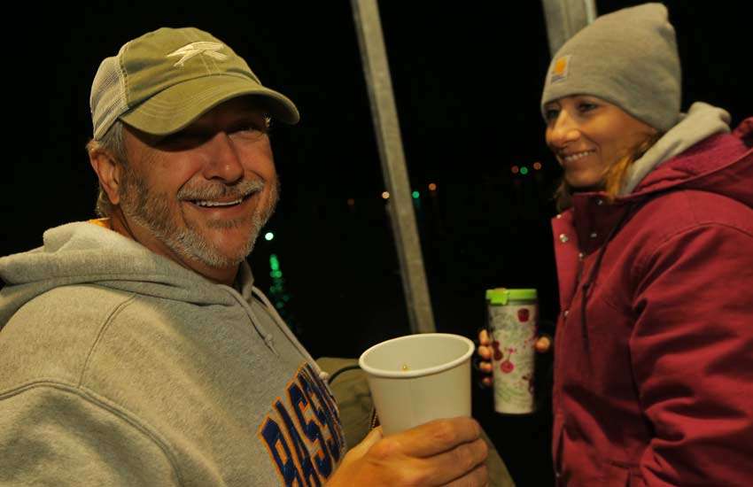 B.A.S.S. workers Tony Quick and Lisa Talmadge warm up with a cup of coffee before working the Day 2 launch of the Toyota Bonus Bucks Bassmaster Team Championship.