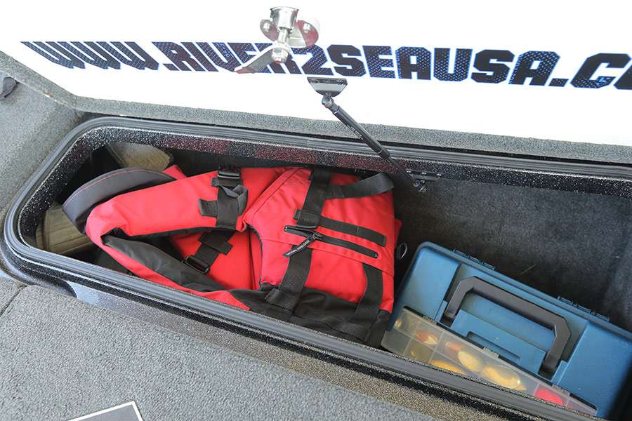 The storage box on the right side of Ishâs boat holds two spinnerbait boxes, a buzzbait box, life jackets and ropes for tying off.