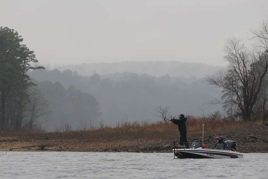 Covered almost entirely in black, Flannagan Fife resembles a samurai as he makes a few pitches along the shore of Lake DeGray during the Toyota Bonus Bucks Bassmaster Team Championship.