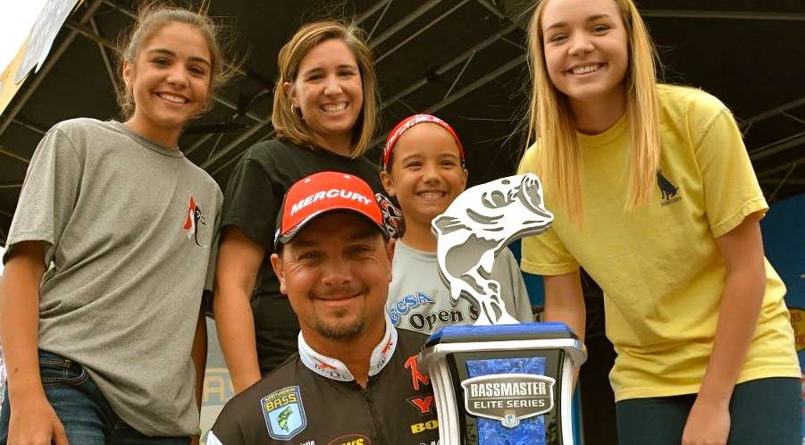 Jason Christie and family came on-stage after he won the Bassmaster Elite Series tournament at Lake Dardanelle last May. They are, from left, Ana, 14; Jason's wife, Amy; Jaslyn, 10; and Ali 