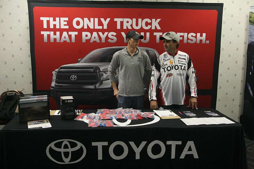 Toyota staff are on hand to answer any questions about their latest products. 