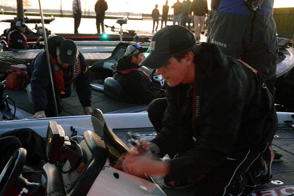 Ronnie Moore of Bassmaster.com installs a GoPro on a contestant boat. The cameras are now part of the coverage at the Bass Pro Shops Bassmaster Opens. 