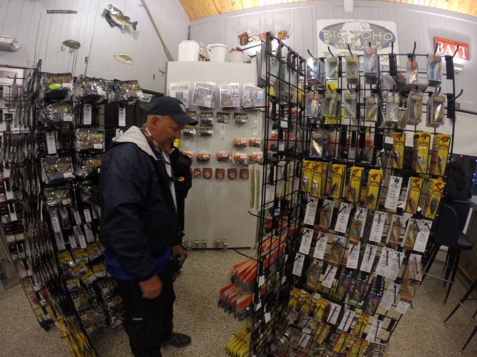 You can never have enough tackle. This angler searches for what he needs at Big Toho Marina. 