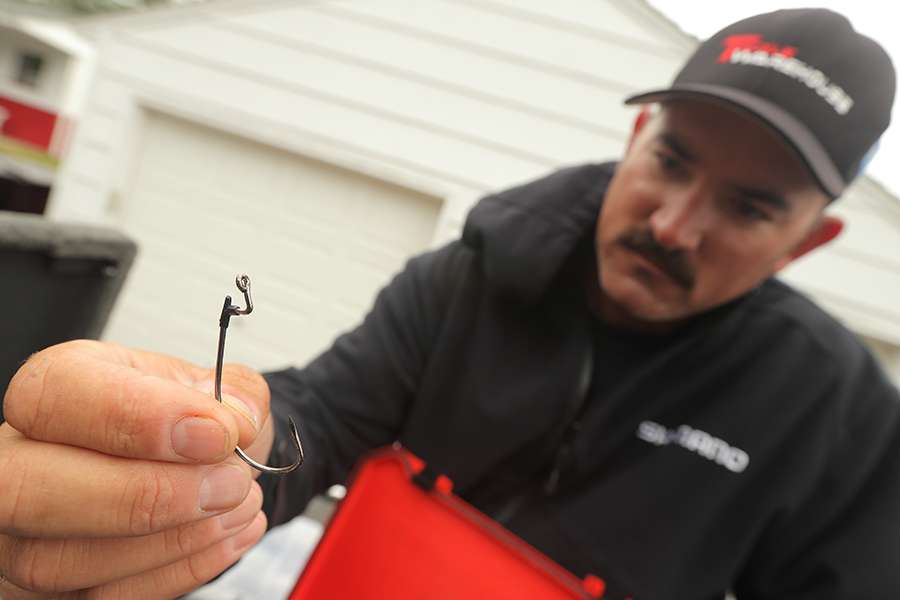 Lintner holds the kind of hook he uses to fish Texas-rigged plastics around structure.