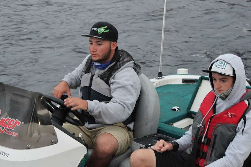 John Duarte and Jonathan Kelley of Coastal Carolina University head out onto the water. 