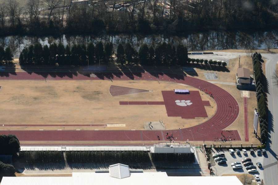 The track and field area showcases various Olympic sports. 