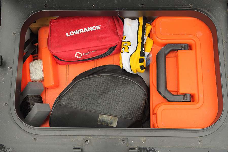 The box behind Lowen's driver's seat holds all of his safety equipment like a first-aid kit, tools, a fire extinguisher, flares and prop wrenches. 
