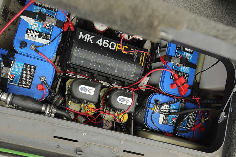 Four batteries and a Minn Kota charger are found in the back compartment just in front of the motor.