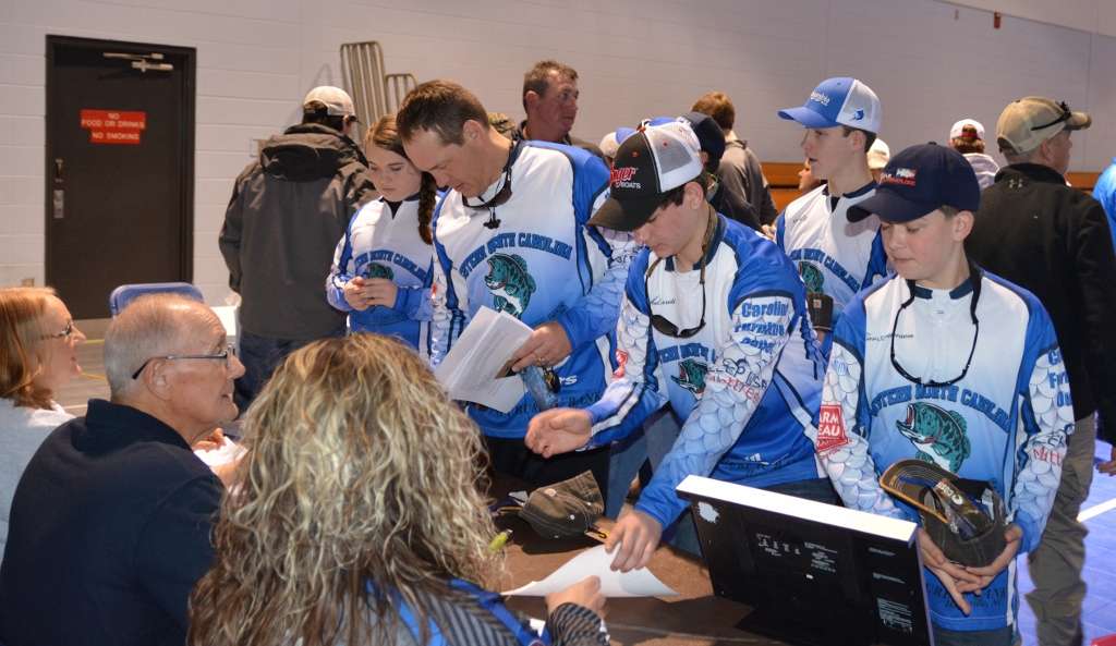 Members of the Western North Carolina Anglers team complete the registration process.