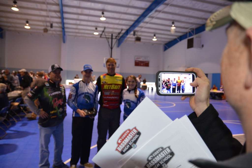 Derrick Moody of the Western North Carolina Anglers Team takes a photo of his team members, Kenda Moody and Seth Utt, with Bassmaster Elite Series pros Greg Vinson and Kelley Jaye.