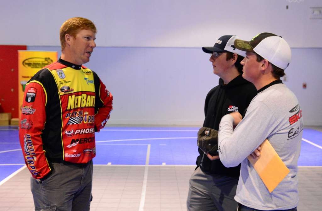 Cameron Mercer and Tyler Presnell of the EFCA Fishing Team from Titus, Ala., chat with Bassmaster Elite Series pro Greg Vinson after completing registration.