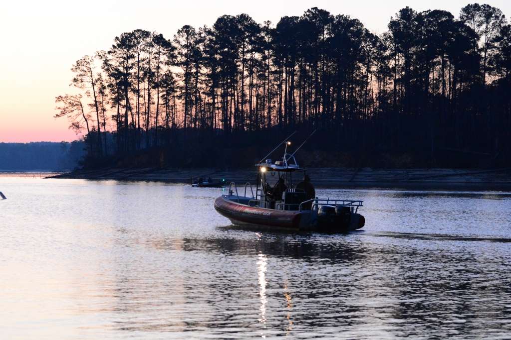 The safety boat moves into position at about 6:05 a.m. with frost still on its sides.