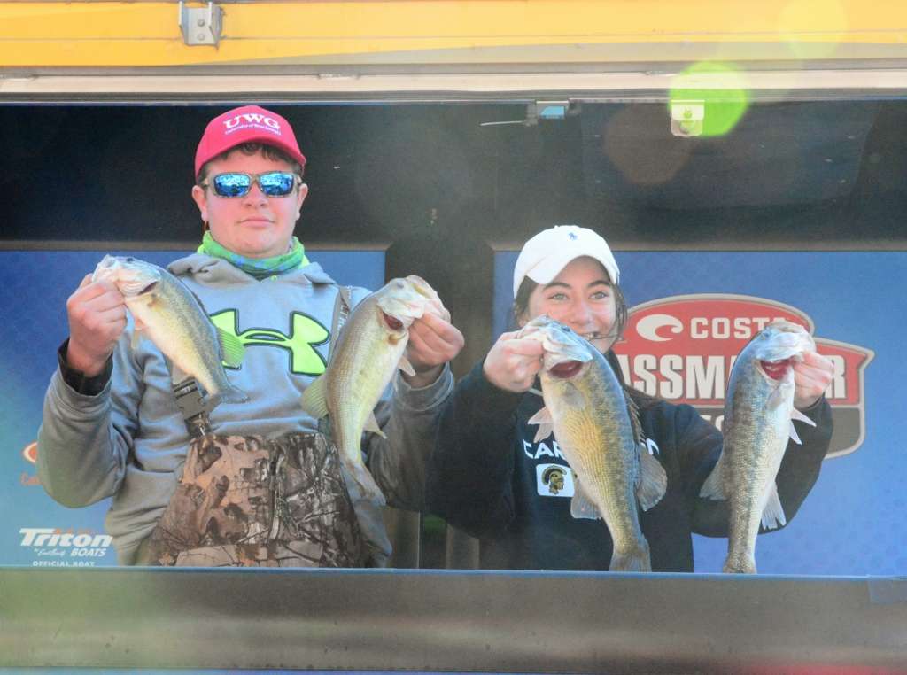 Ben Muse, left, and Taylor Cox hold up four nice bass. They finished in 11th place with 10 pounds, 8 ounces.