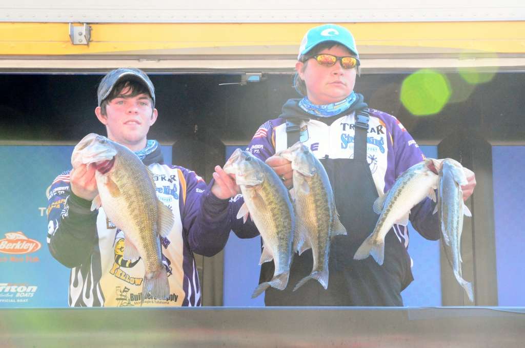 Josh Powers, left, and Cole Stewart of the Grundy County High School Fishing Team show off their winning catch. They claimed first place with 14 pounds, 4 ounces. 