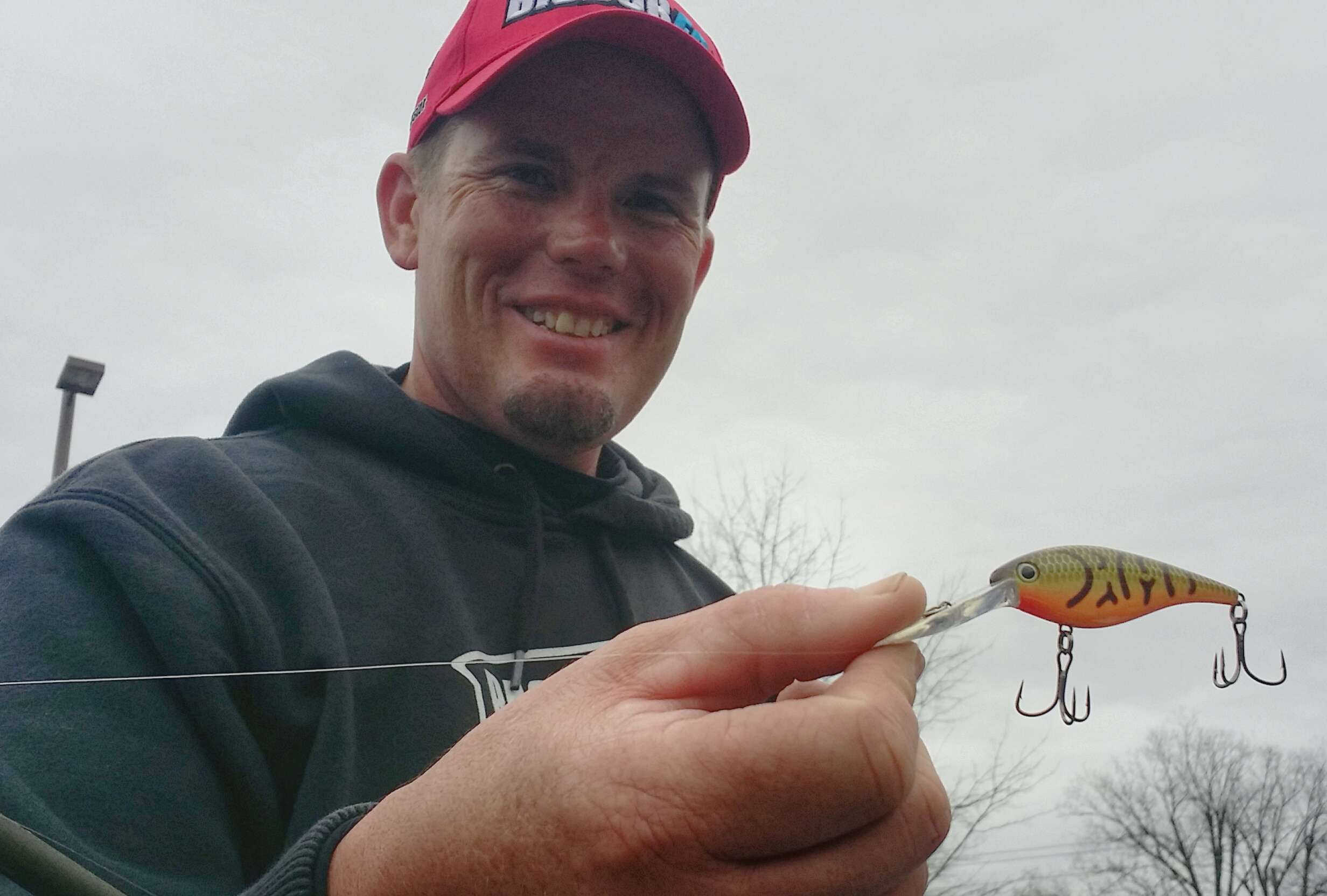 Keith Combs keyed on bridge riprap, channel-swing banks, and steep banks with rock and stumps. He fished a Strike King Pro Model Lucky Shad (crawdad), and reeled it very slowly, 