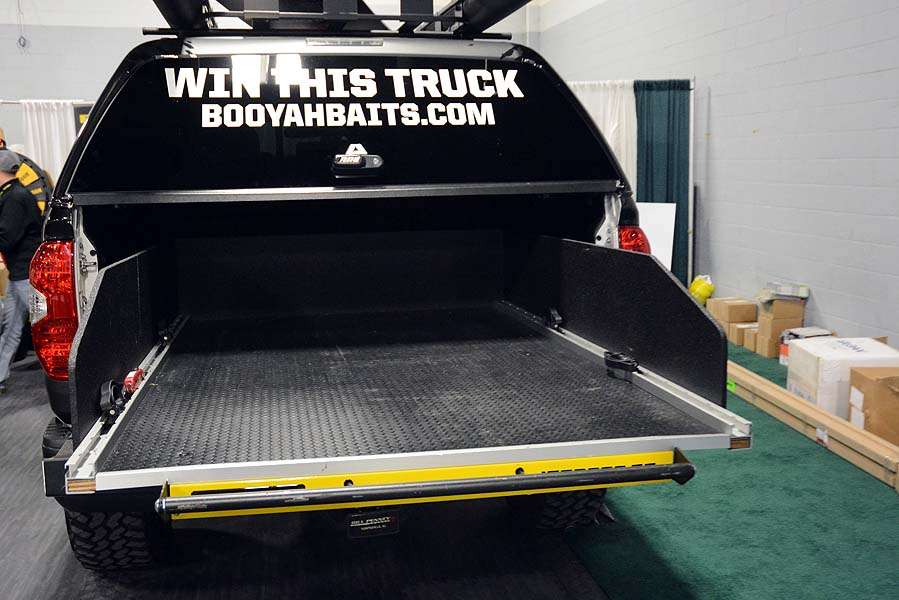 The truck indeed is tricked out. This BEDSLIDE turns the truck bed into a sliding drawer, making it easier to reach bulky, heavier gear that stays protected under a A.R.E. Truck Cap. 