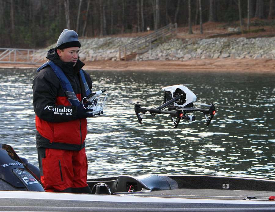 Trey Murdaugh, part of the TV coverage crew, arrives at Rojasâ fishing spot and launches a drone to capture aerial video.