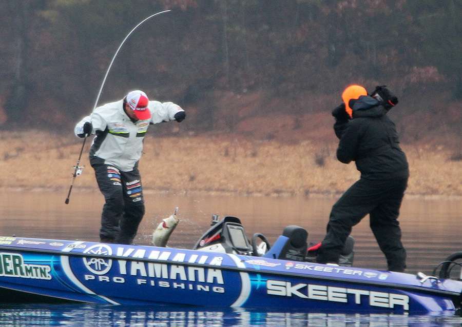 Rojas drops his first bass of the day into the floor of the boat. 