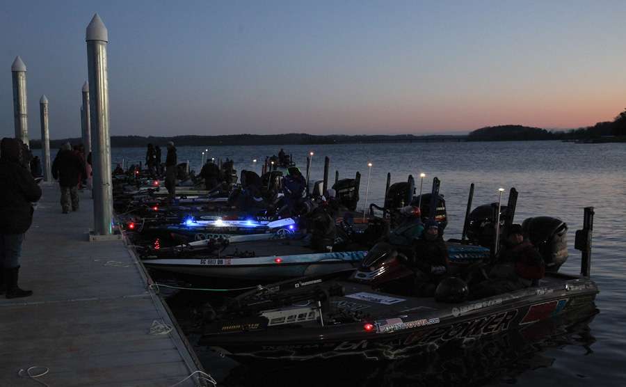 Boats begin to line the launch dock at dawn. 