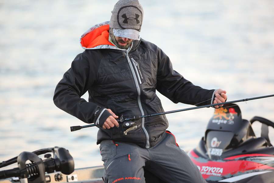 After pulling close to twenty rods from his rod locker, Mike Iaconelli begins to organize them on the deck of the boat. 