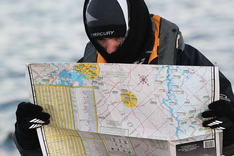 Despite having the latest electronics in his boat, Van Soles pulls a paper map from his dry storage and goes old school. 