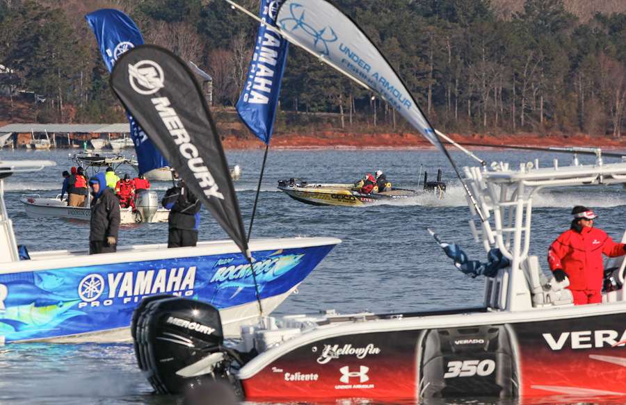 The big boats from Yamaha and Mercury watch the takeoff. 